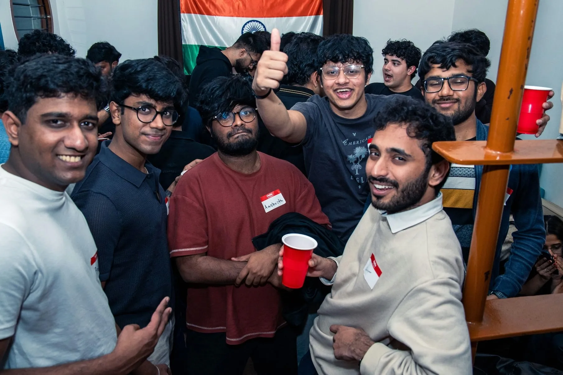 Thumbs up under the flag